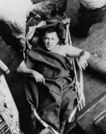 Injured man on a stretcher aboard USS Minneapolis, 1 Dec 1942