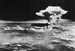 Mushroom cloud rising above Hiroshima, Japan, 6 Aug 1945