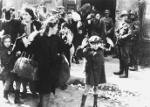 Jewish boy Artur Dab Siemiatek, Levi Zelinwarger, or Tsvi Nussbaum being rounded up by Josef Blösche and other SS troops, Warsaw, Poland, Apr-May 1943