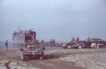 LST-1 landing US Army trucks and field guns onto a beach near Salerno, Italy, Sep 1943