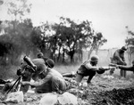 African-American troops of the US 92nd Infantry Division shelling Germans with their mortar rounds near Massa, Italy, circa Nov 1944