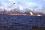 Explosions and yellow signal smoke just offshore and on Iwo Jima, 19 Feb 1945, photo 1 of 2