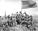 US Marines posing with the second flag atop Mount Suribachi, Iwo Jima, Japan, 23 Feb 1945