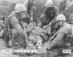 Wounded US Marine Corporal W. H. Porter being prepared for evacuation, Iwo Jima, Japan, 21 Feb 1945