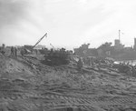 Scene on a Iwo Jima beach, as supplies were unloaded and trucked inland, circa late Feb 1945