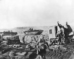 US Marines digging in on a beach at Iwo Jima, Japan, 21 Feb 1945, photo 2 of 2