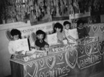 Fourth grade Japanese-American children at a cooperative store stand selling valentines, Jerome War Relocation Center, Arkansas, United States, Feb 1944, photo 2 of 3