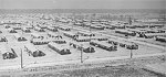 View of the War Relocation Authority camp, looking northwest from the hospital, near Jerome, Arkansas, United States, 17 Nov 1942, photo 1 of 2