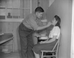 Japanese-American dentist and patient, Jerome War Relocation Center, Arkansas, United States, 17 Nov 1942