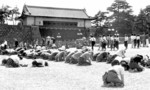 Japanese civilians listening to Emperor Showa