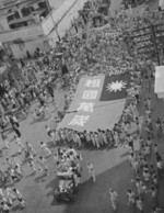 Ethnic Chinese civilians celebrating WW2 victory in Singapore, Sep 1945