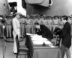 Mamoru Shigemitsu signing the surrender instrument aboard USS Missouri, Tokyo Bay, Japan, 2 Sep 1945, photo 1 of 4