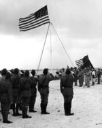 Raising the US flag over Wake Island after Japan
