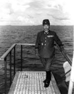 Lieutenant General Shunzaburo Mugikura aboard Portland to surrender Truk, Caroline Islands, which is visible in background, 2 Sep 1945
