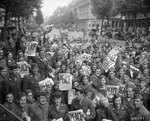 American servicemen and women gathered in front of 
