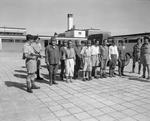 Accused Japanese war criminals under guard while awaiting transfer to Stanley Prison, Hong Kong, 29 Sep 1945