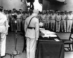 Xu Yongchang signing the surrender document on behalf of China aboard USS Missouri, Tokyo Bay, Japan, 2 Sep 1945, photo 1 of 5