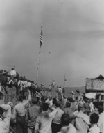 American captives at Hakodate Branch Camp No. 3 in Hokkaido, Japan waving at a circling US aircraft, 1945