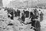 Citizens of Leningrad, Russia cleaning rubbles off a street, 8 Mar 1942
