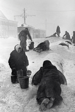 Civilians of Leningrad fetching water from a broken water pipe, Russia, Dec 1941-Jan 1942