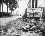 Men of the 8th Infantry Regiment attempted to move forward but were pinned down by German small arms from within the Belgian town of Libin, 7 Sep 1944