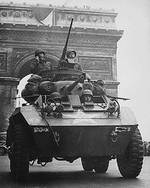 M8 Greyhound armored car passing under the Arc de Triomphe, Paris, France, Aug 1944