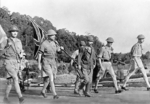 British Army Lieutenant General Arthur Percival and his party carrying the United Kingdom flag on their way to surrender Singapore to the Japanese, 15 Feb 1942, photo 1 of 2