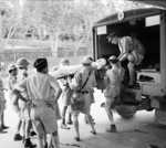 A British soldier wounded during fighting in Malaya was being put onto an ambulance in Singapore, circa Dec 1941 to Jan 1942