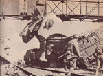 Japanese attacking across a railroad track somewhere in Malaya, circa Dec 1941-Feb 1942