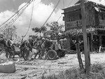 US Marines pushing a 37mm gun into position, Garapan, Saipan, Mariana Islands, 2 Jul 1944