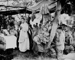 A US Navy chaplain holds mass for Marines killed during the Saipan landings, Jun 1944