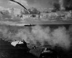 Japanese aircraft being shot down as it attempted to attack escort carrier Kitkun Bay, near Marianas Islands, Jun 1944, photo 1 of 2