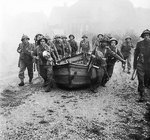 British infantry carrying assault boats in preparation for crossing the Meuse-Escaut canal at Lille-St Hubert, Belgium, 19 Sep 1944