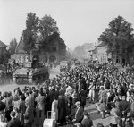 Sherman tanks advancing through cheering crowds in Valkenswaard, the Netherlands, 18 Sep 1944