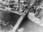 Aerial view of the bridge over the Nederrijn, near Arhnem, the Netherlands, circa 19 Sep 1944; note British troops and armored vehicles at north end of the bridge