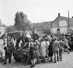 Vehicles and men of the Guards Armoured Division of the British XXX Corps passing through Grave, southern Netherlands, 19 Sep 1944