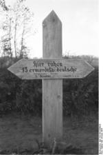 Grave marker for 13 German civilians killed by Soviets, Nemmersdorf, East Prussia, Germany, late Oct 1944, photo 2 of 2
