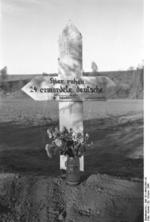 Grave marker for 24 German civilians killed by Soviets, Nemmersdorf, East Prussia, Germany, late Oct 1944, photo 1 of 3