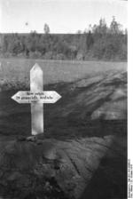Grave marker for 24 German civilians killed by Soviets, Nemmersdorf, East Prussia, Germany, late Oct 1944, photo 3 of 3