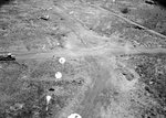 Parafrag bombs descending on a Japanese airstrip at Wewak, Australian New Guinea, 1943