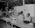 African-American soldiers of the US Army 477th Antiaircraft Artillery, Air Warning Battalion studying maps, Oro Bay, New Guinea, 15 Nov 1944