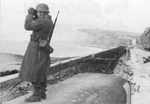 German soldier observing the Atlantic coastline, France, circa 1943-1944