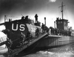 US soldiers disembarking from an LCI(L) landing craft during amphibious invasion training in England, United Kingdom in preparation for Operation Overlord, mid-1944
