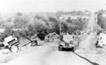 Abandoned German equipment on a road to Avranches, France during Operation Cobra, 31 Jul 1944