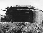 A German gun emplacement located near the town of Ste. Marie du Mont near Utah Beach, showing damage inflicted by Allied gunfire during the Normandy invasion; photo taken 10 Sep 1944