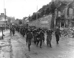 US Army troops marched German prisoners of war through Cherbourg, 28 Jun 1944