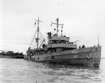 ATO Owl entered Cherbourg harbor, France, towing two barges loaded with engineer equipment, 18 Jul 1944; she was the first ship carrying supplies to enter Cherbourg harbor after Allied victory