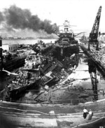 Wrecks of destroyers Downes and Cassin in Drydock One at Pearl Harbor Navy Yard, 7 Dec 1941 about 1400, photo 1 of 5; note Pennsylvania in the rear, Helena in distance, Oklahoma and Maryland in far background