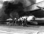 PBY patrol bomber burning at Naval Air Station Kaneohe, Oahu, during Pearl Harbor attack