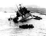 USS Utah capsizing early in the attack on Pearl Harbor, Dec 7, 1941.  Photo taken from USS Tangier.